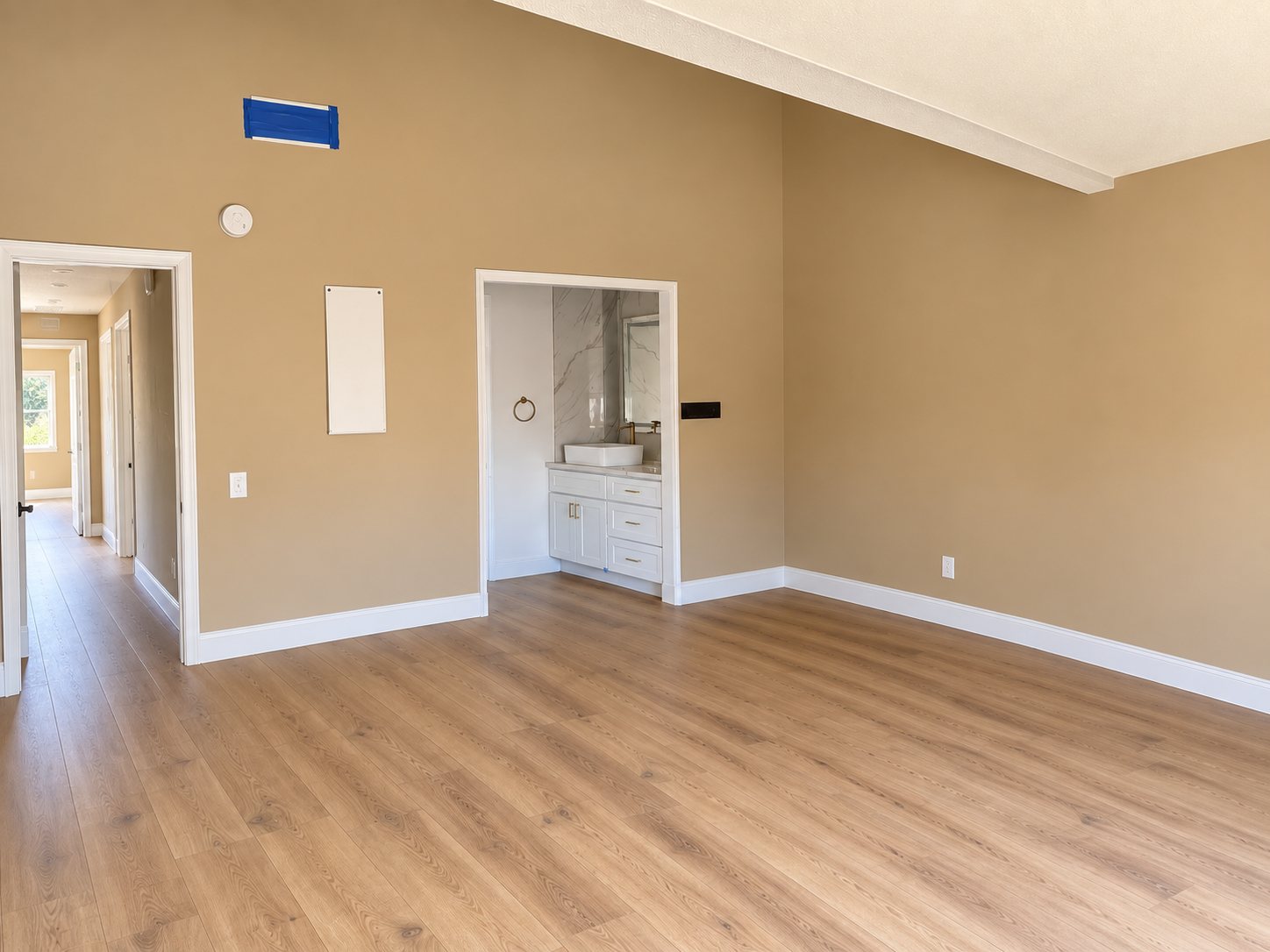 The same bedroom after remediation: clean walls and baseboards, mold removed.